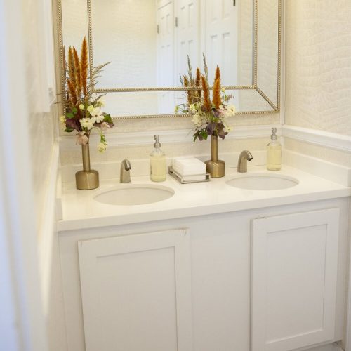 Black Tie restroom trailer custom interior with luxury lighting, sink, wood flooring, crown molding and trim